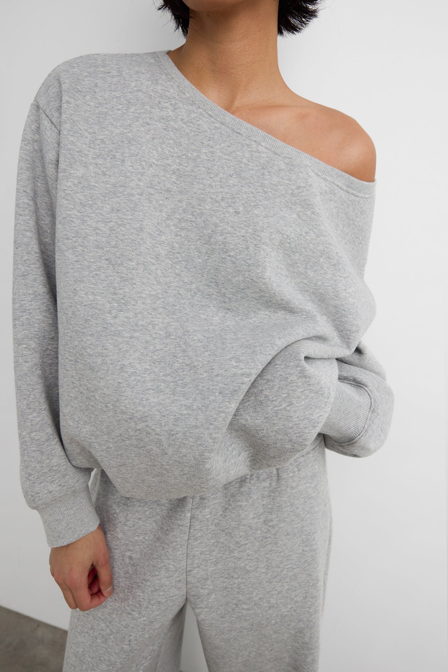 FLEECE STUDIO OFF SHOULDER BUBBLE HEM SWEATSHIRT